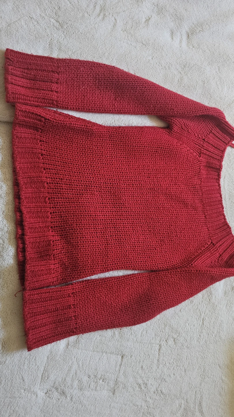 Red off-the-shoulder knit sweater