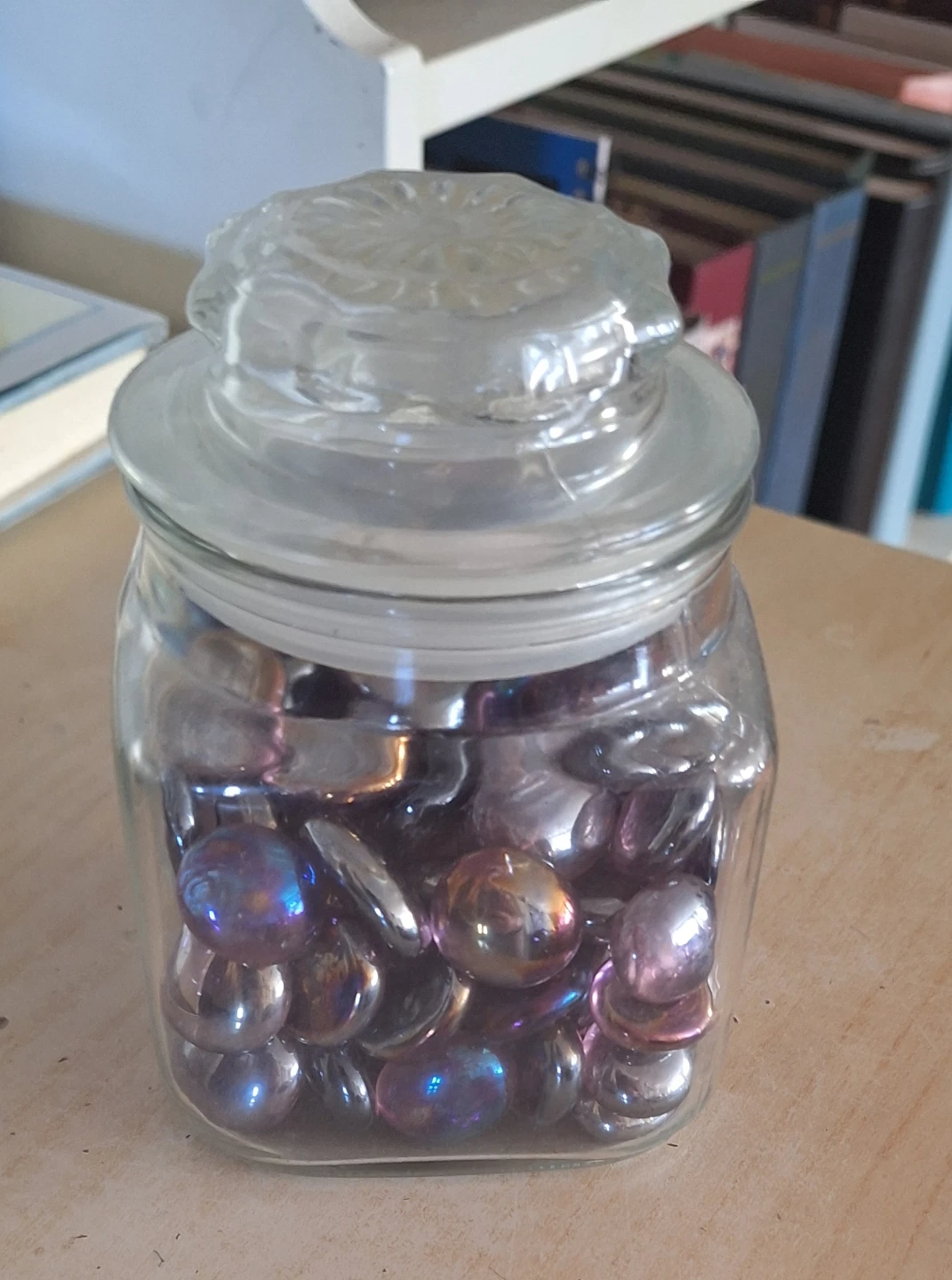 Glass storage jar with iridescent decorative stones