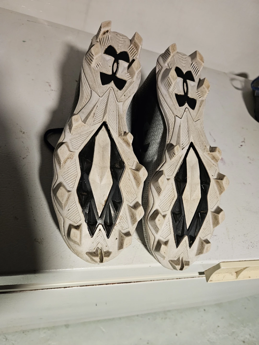 Three pairs of assorted athletic cleats - photo 2