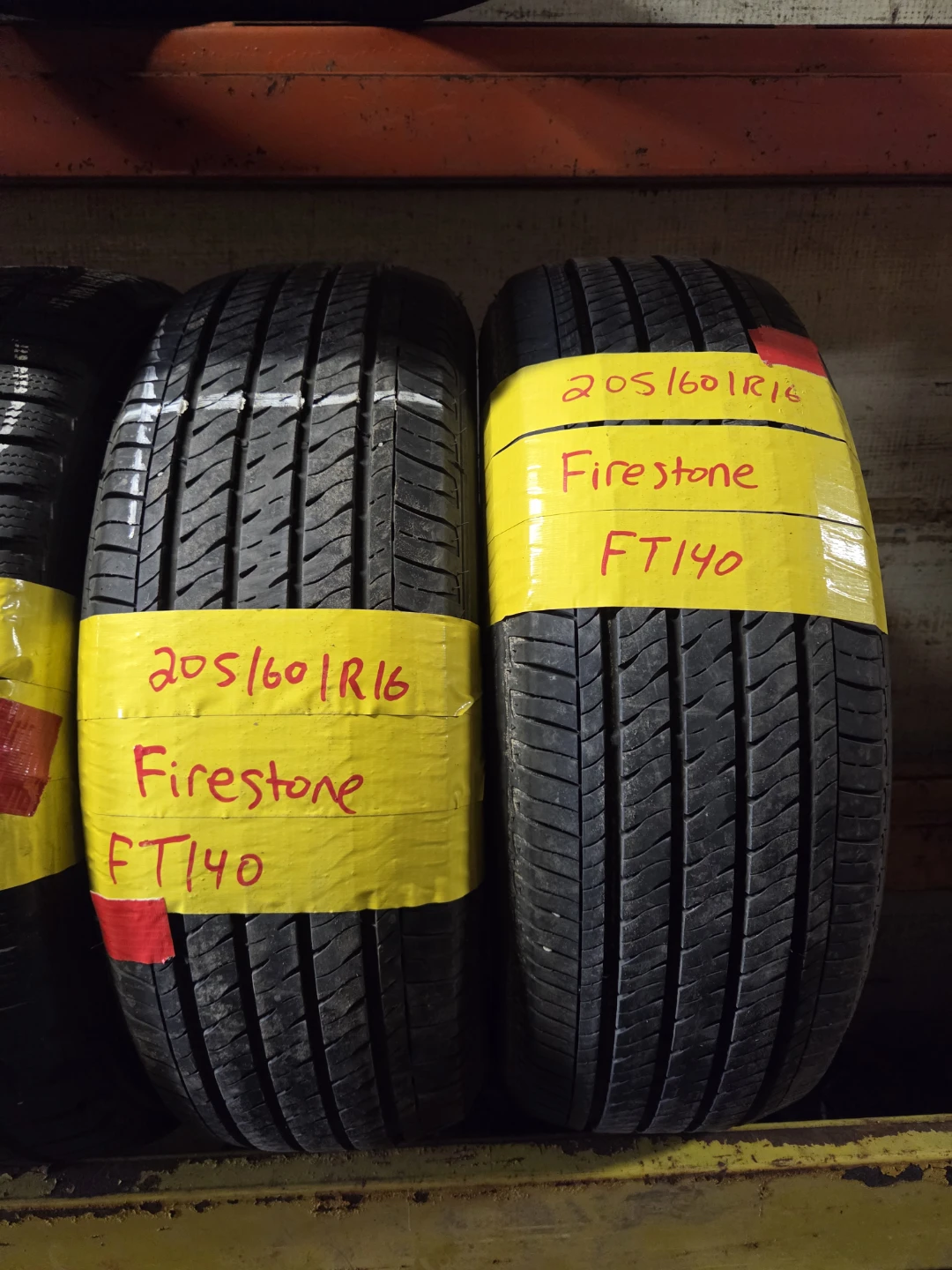 Two Firestone FT140 205/60R16 Tires