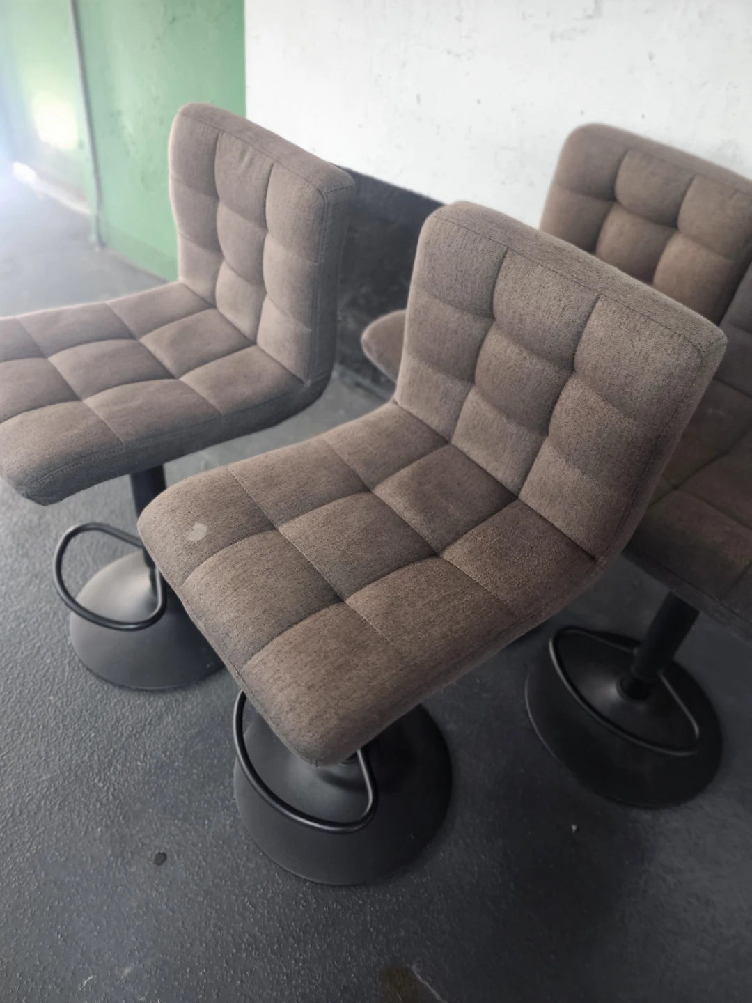Set of 4 grey upholstered swivel bar stools