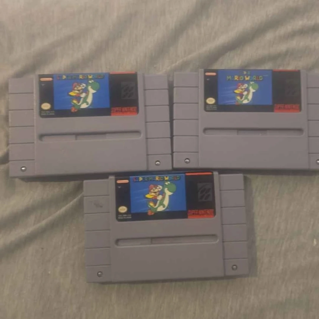 Three Super Mario World SNES Cartridges