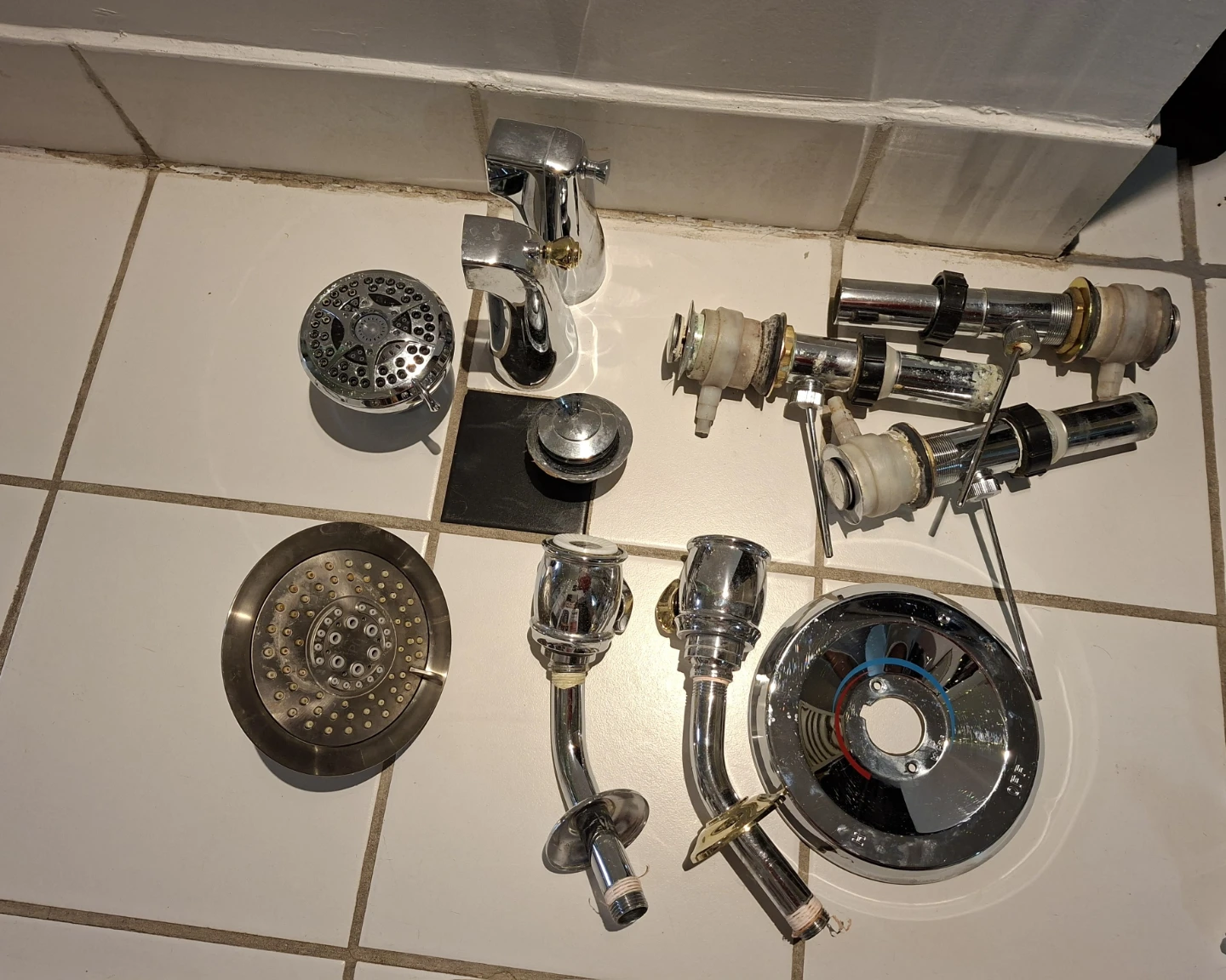 Assorted Bathroom Faucet and Shower Fixtures