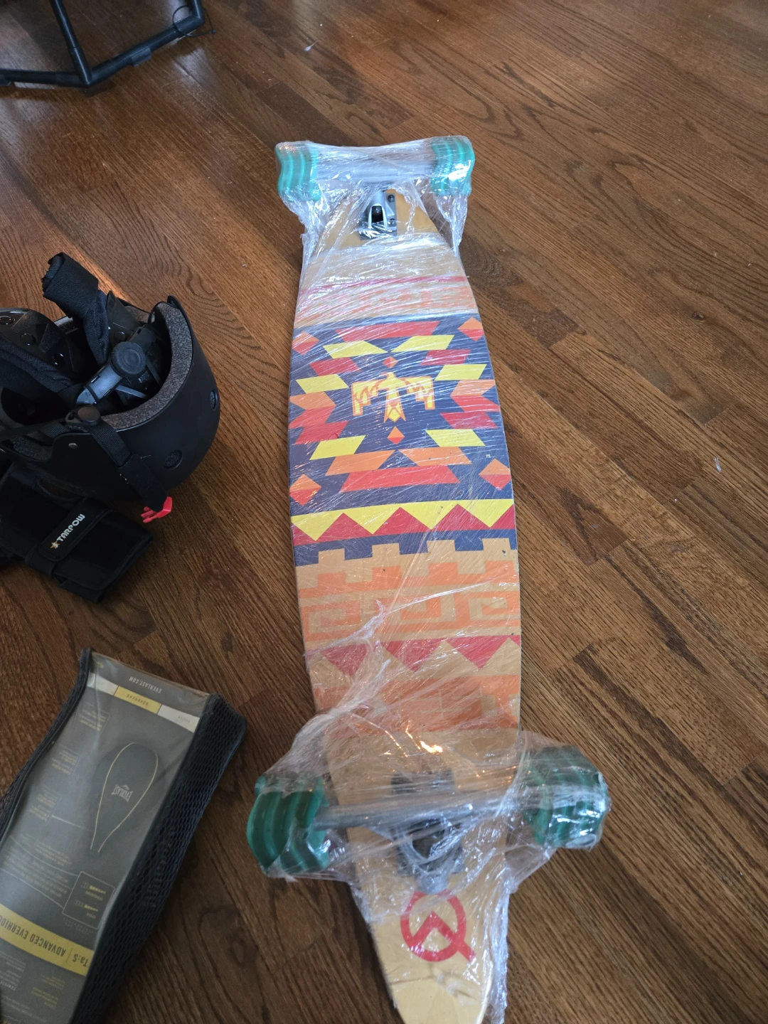 Longboard with helmet, knee and elbow pads