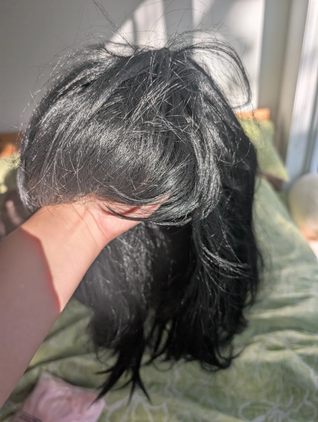 Black shoulder-length synthetic wig