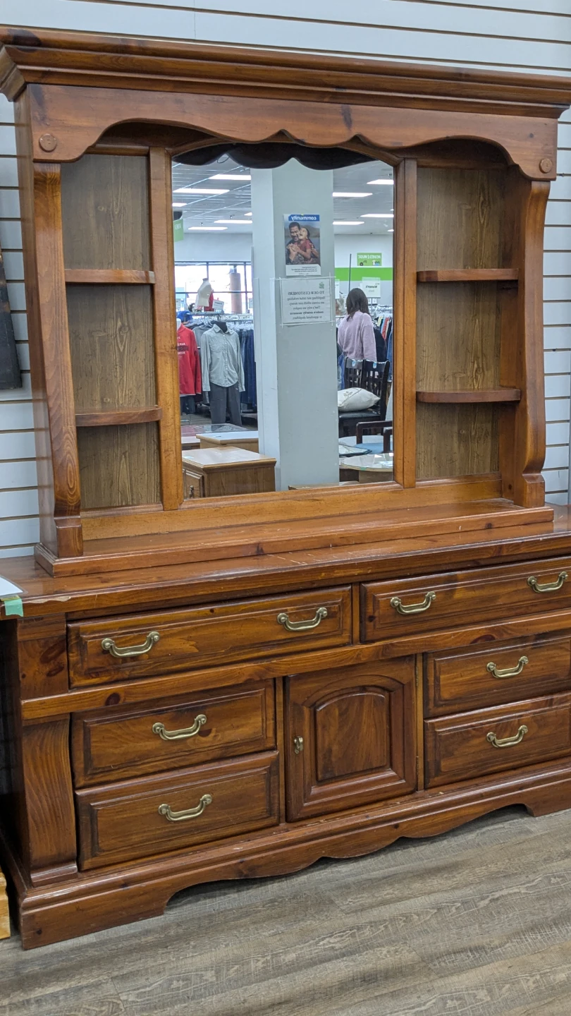 Wooden dresser with drawers.