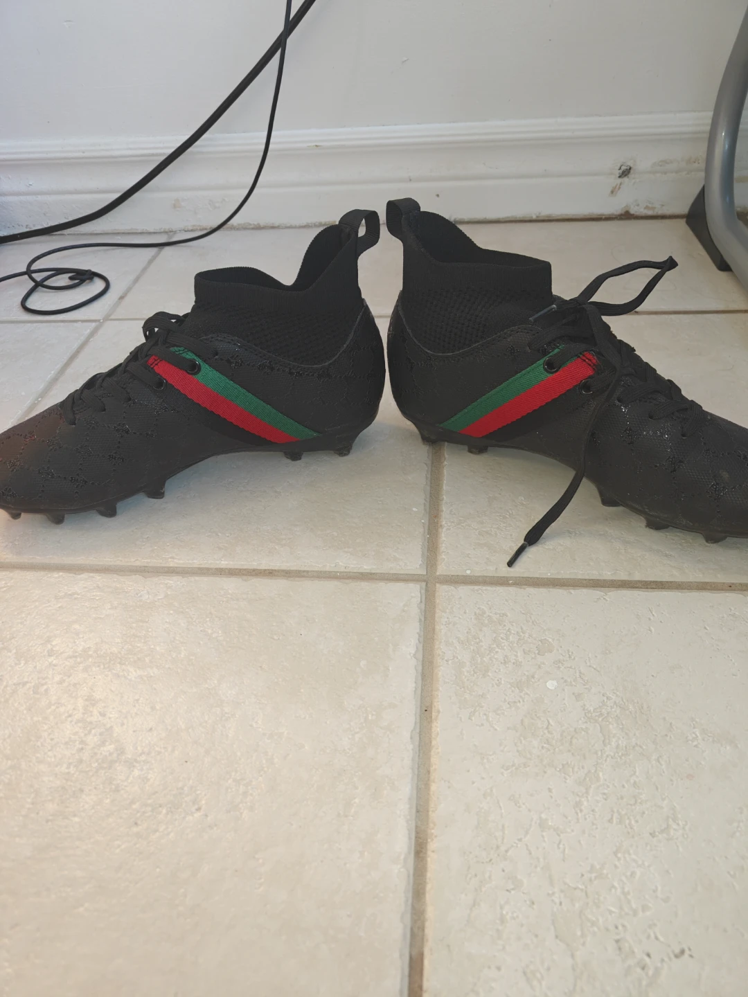 Black soccer cleats with green and red accents - photo 3