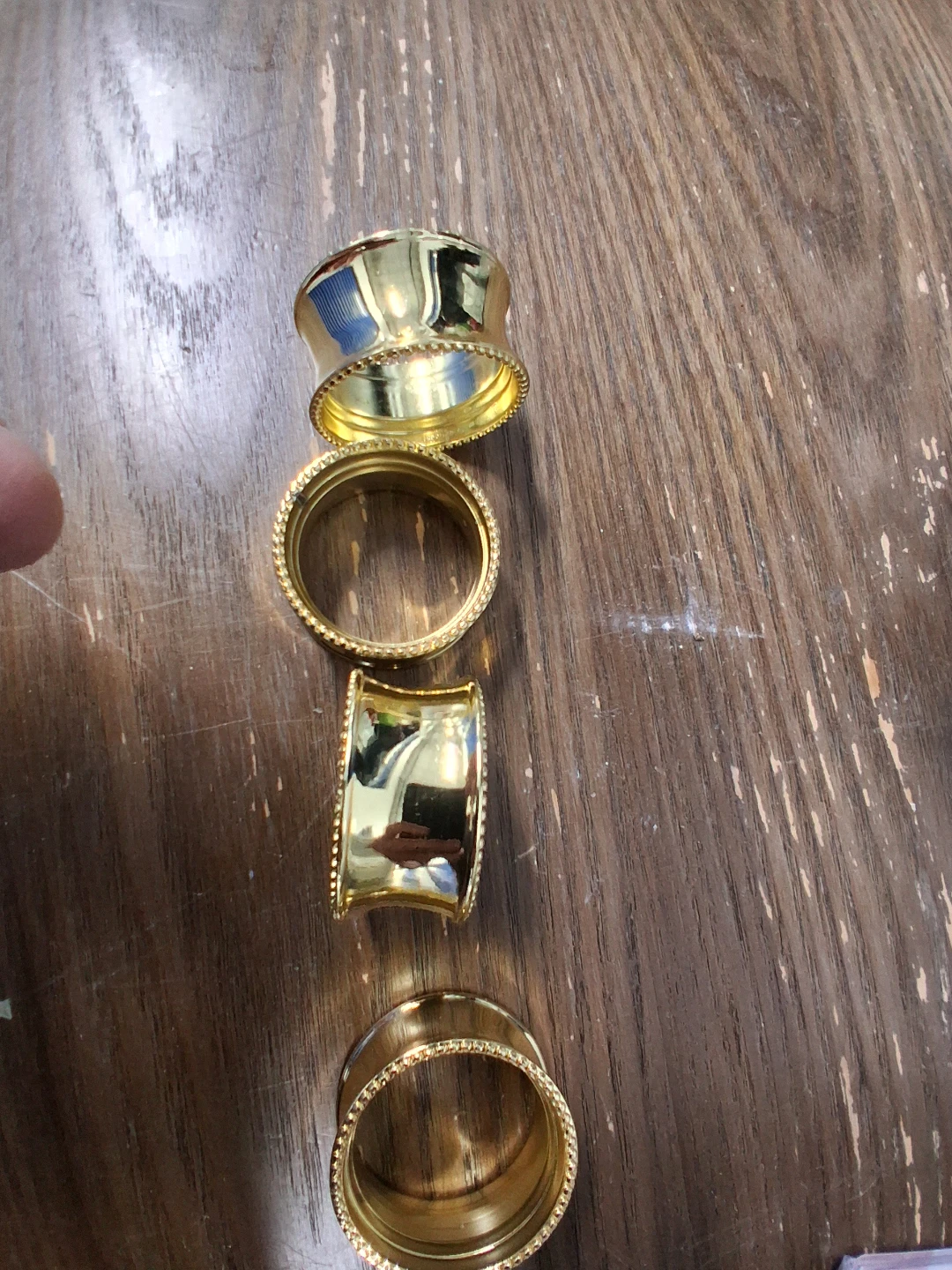 Set of 4 Gold Tone Napkin Rings