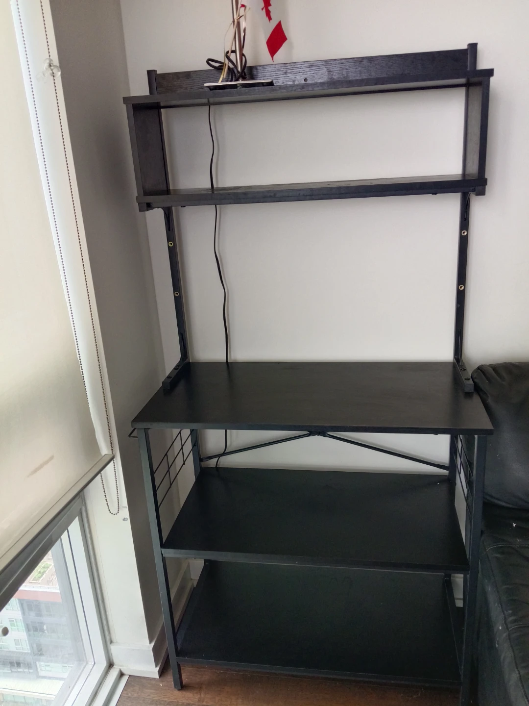 Black rack with metal frame shelves