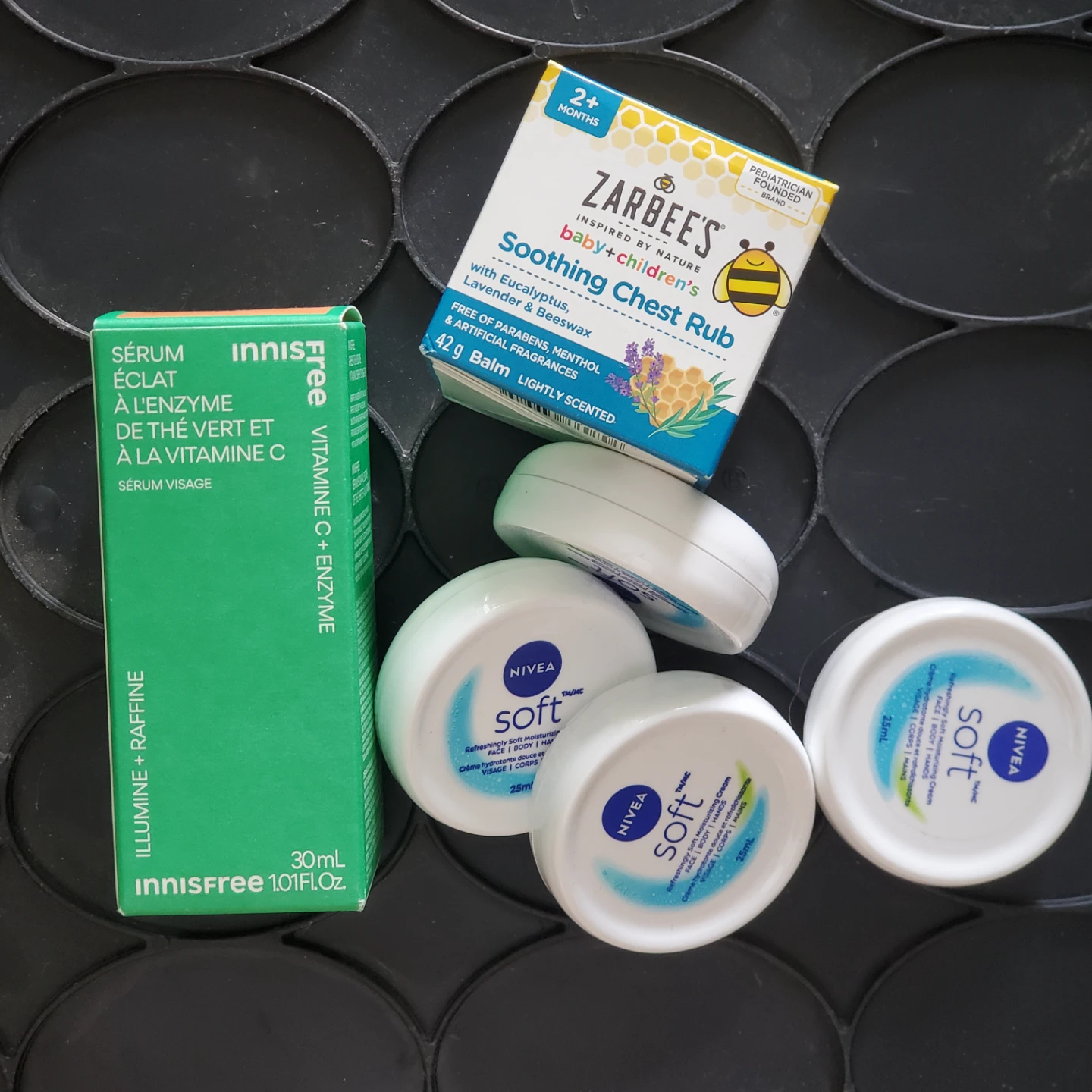 Innisfree Serum, Zarbee's Rub, and Nivea Soft Cream
