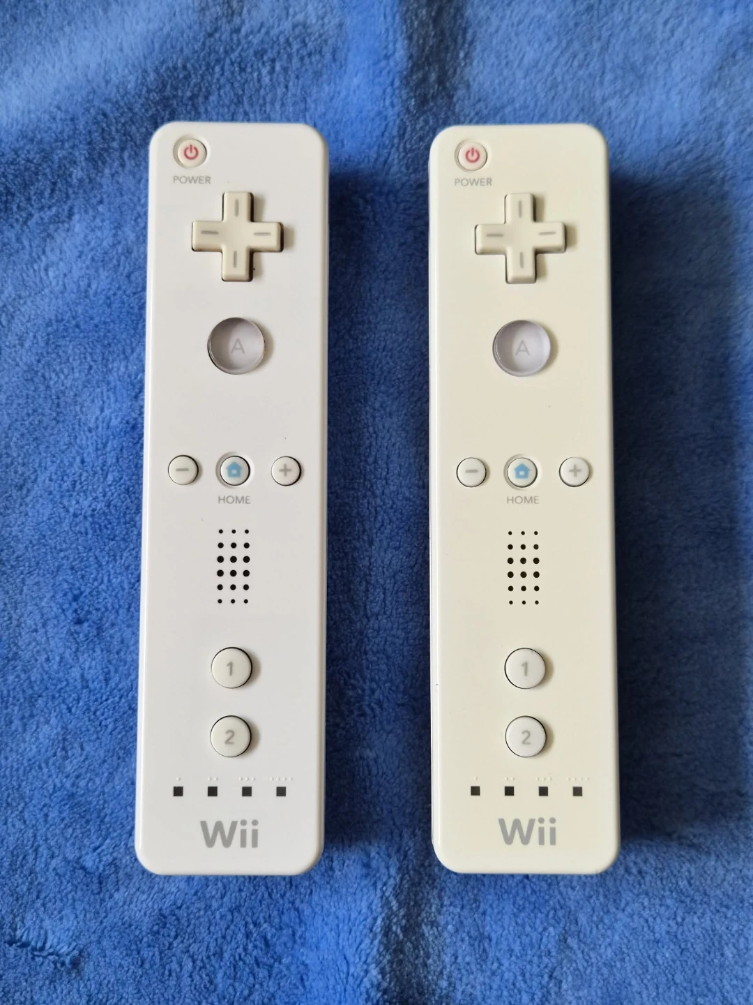 Read Bio | Pair Of Broken Wii Remotes