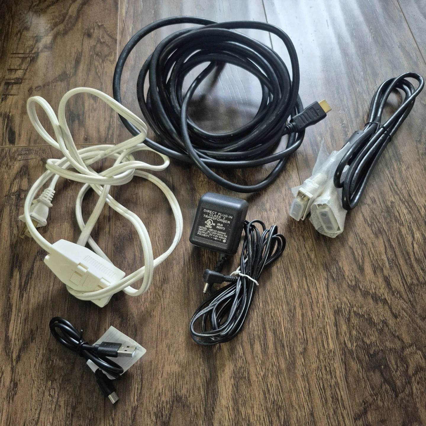 Assorted Electronic Cables and Power Adapter