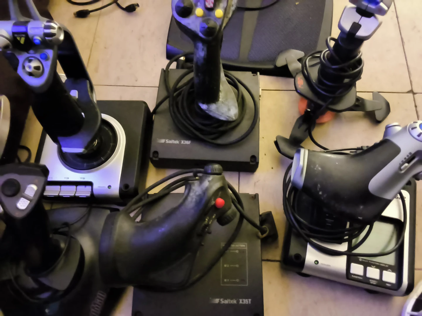 Collection of Vintage Saitek Joysticks and Throttles