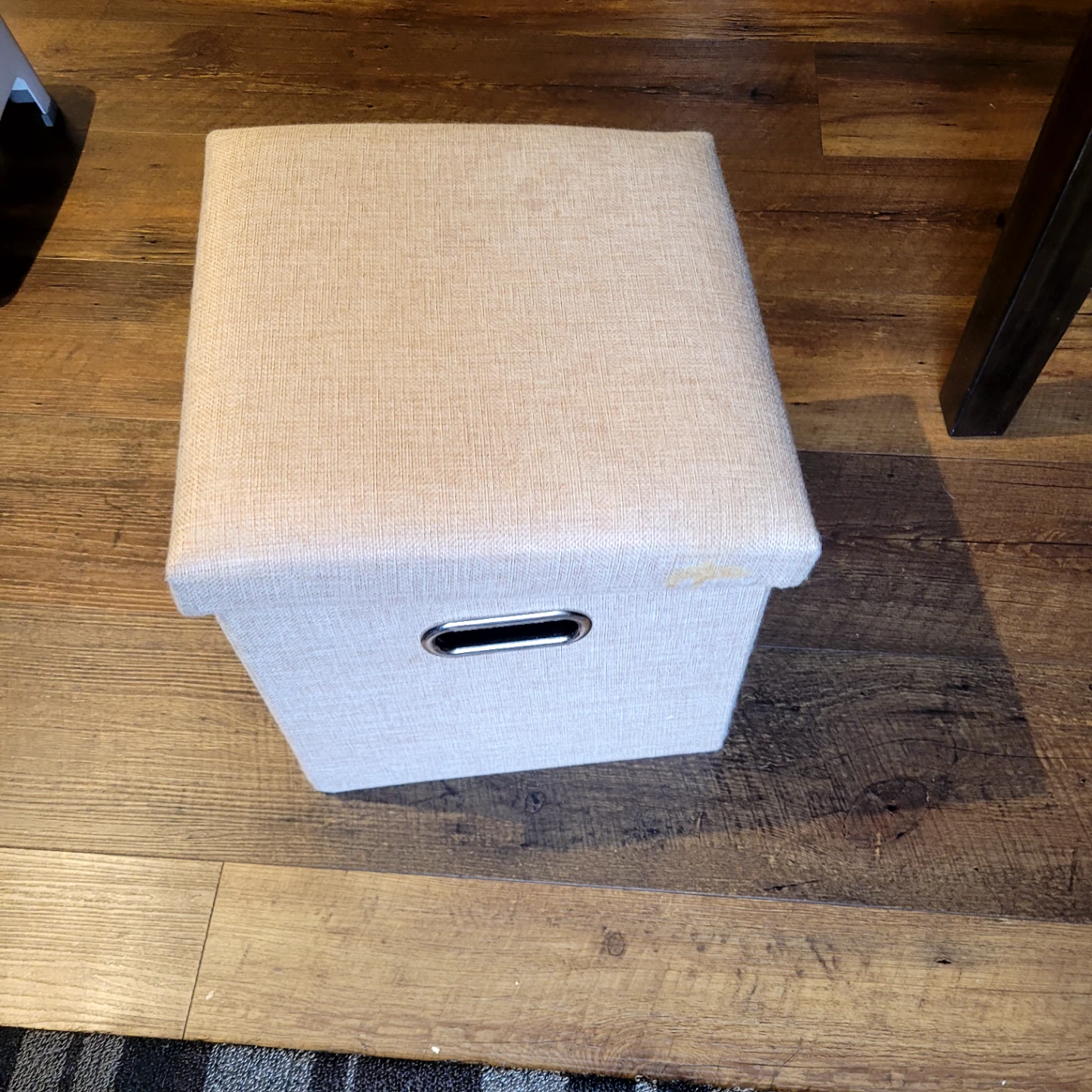 Collapsible beige storage ottoman