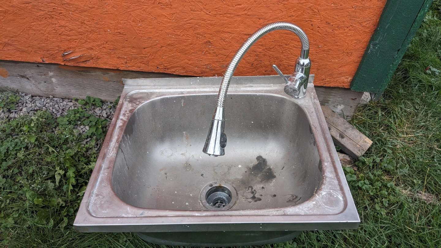 Stainless steel utility sink with pull-down faucet