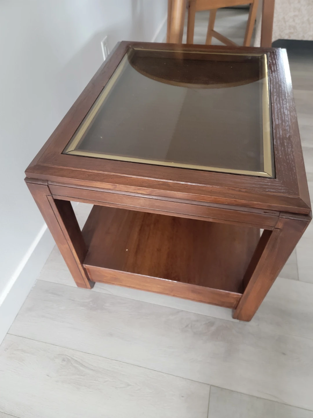 Wooden end table with glass top