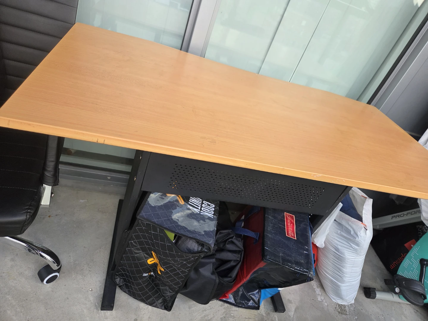 Simple wooden desk with black metal frame