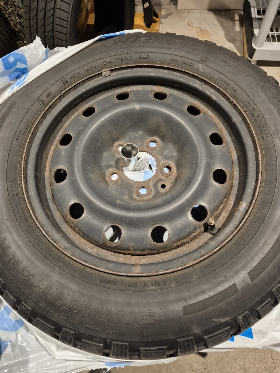 FOUR USED SNOW TIRES ON STEEL RIMS215/65R16 Tires