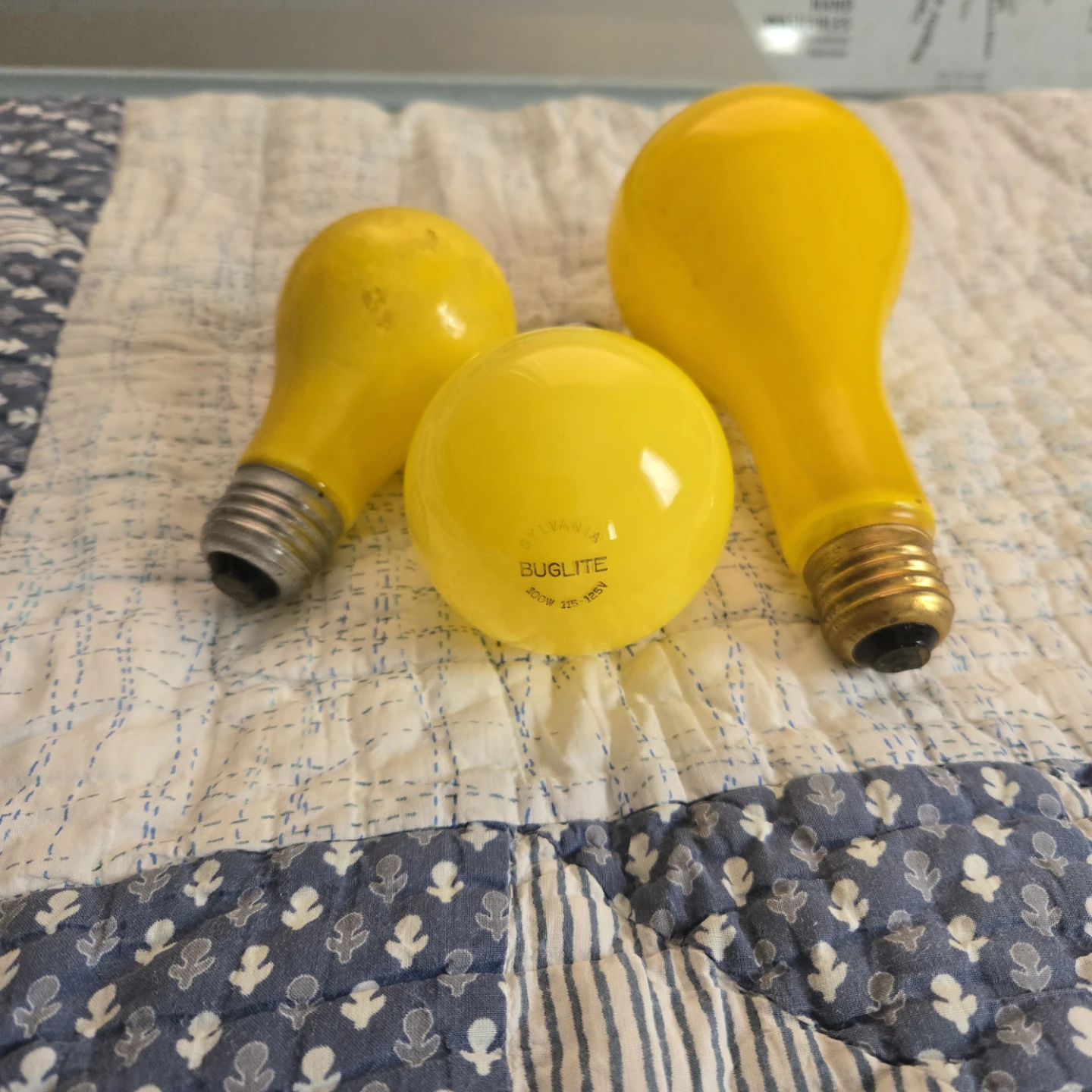 Three Sylvania Buglite Yellow Light Bulbs