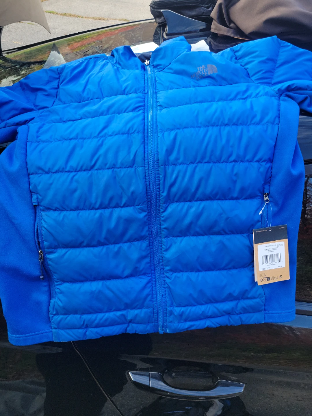 Selection of brand new outdoor jackets and vests