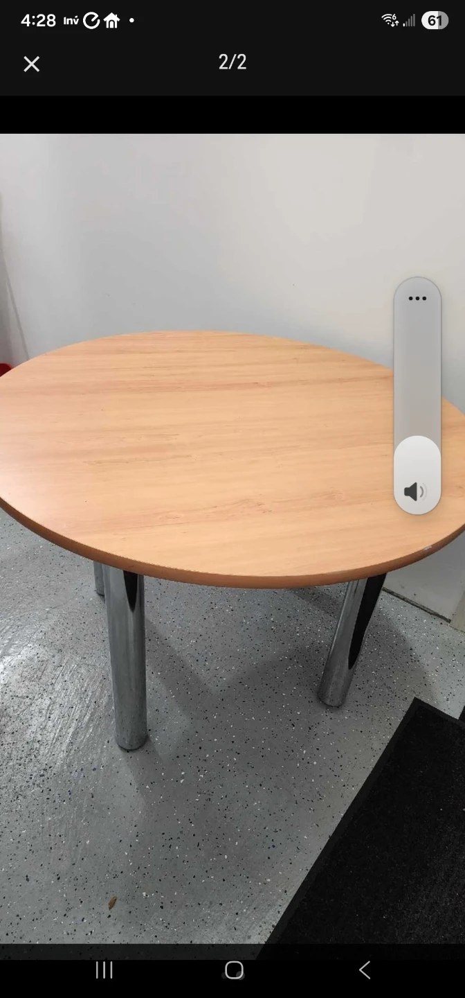 Round wooden table with metal legs