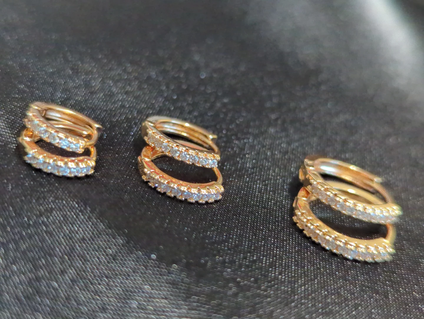 Three Pairs of Gold Hoop Earrings with Crystals