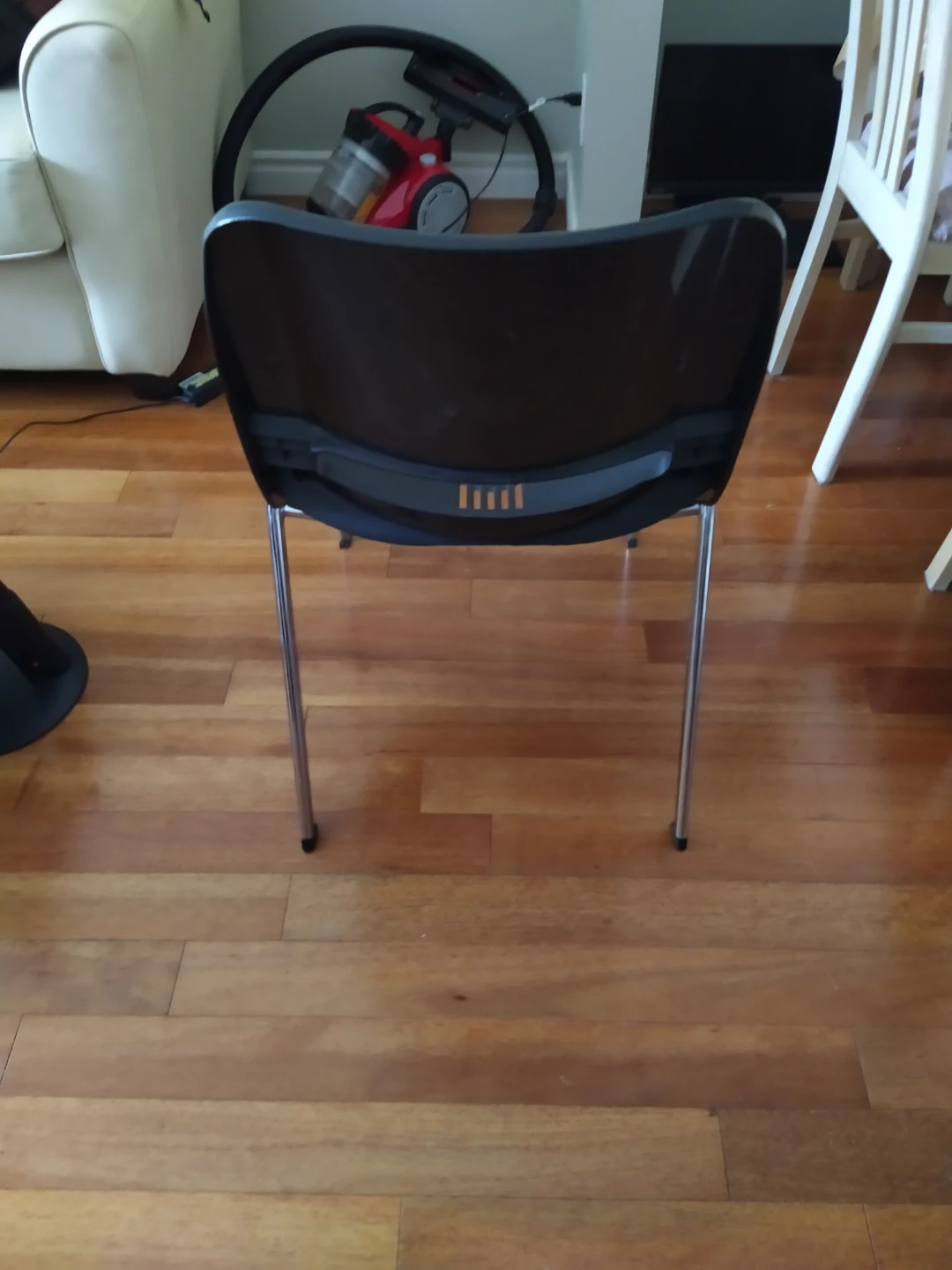 Black plastic stacking chair with chrome legs - photo 2