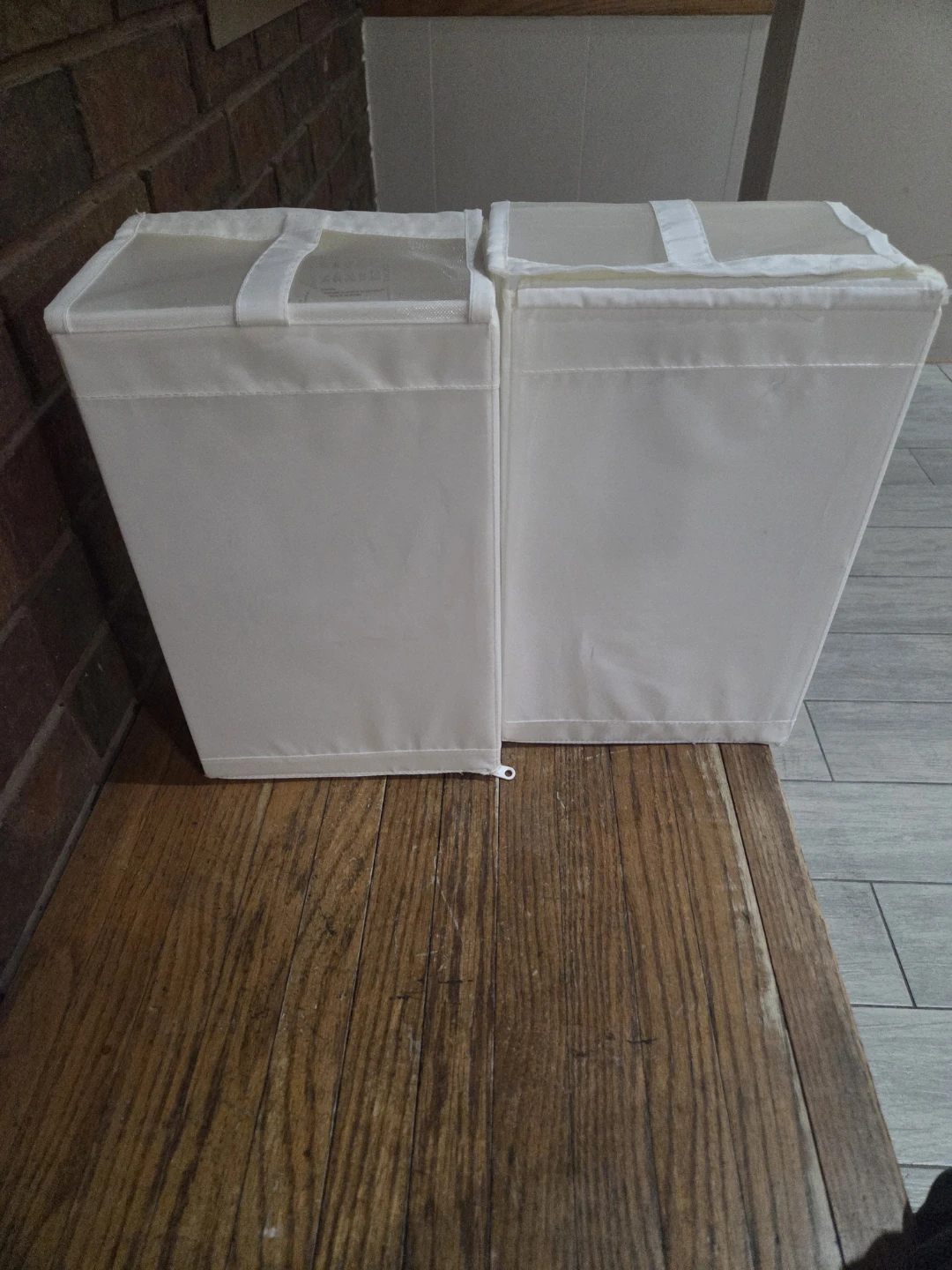 Two white fabric storage bins