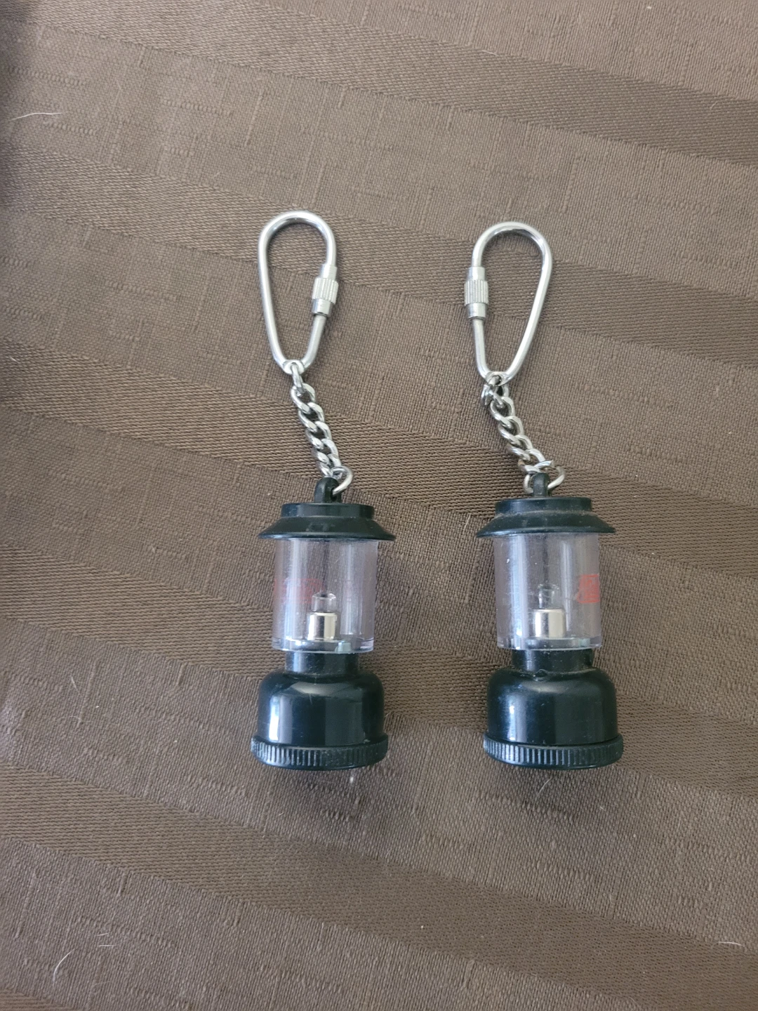 Two Coleman Mini Lantern Keychains