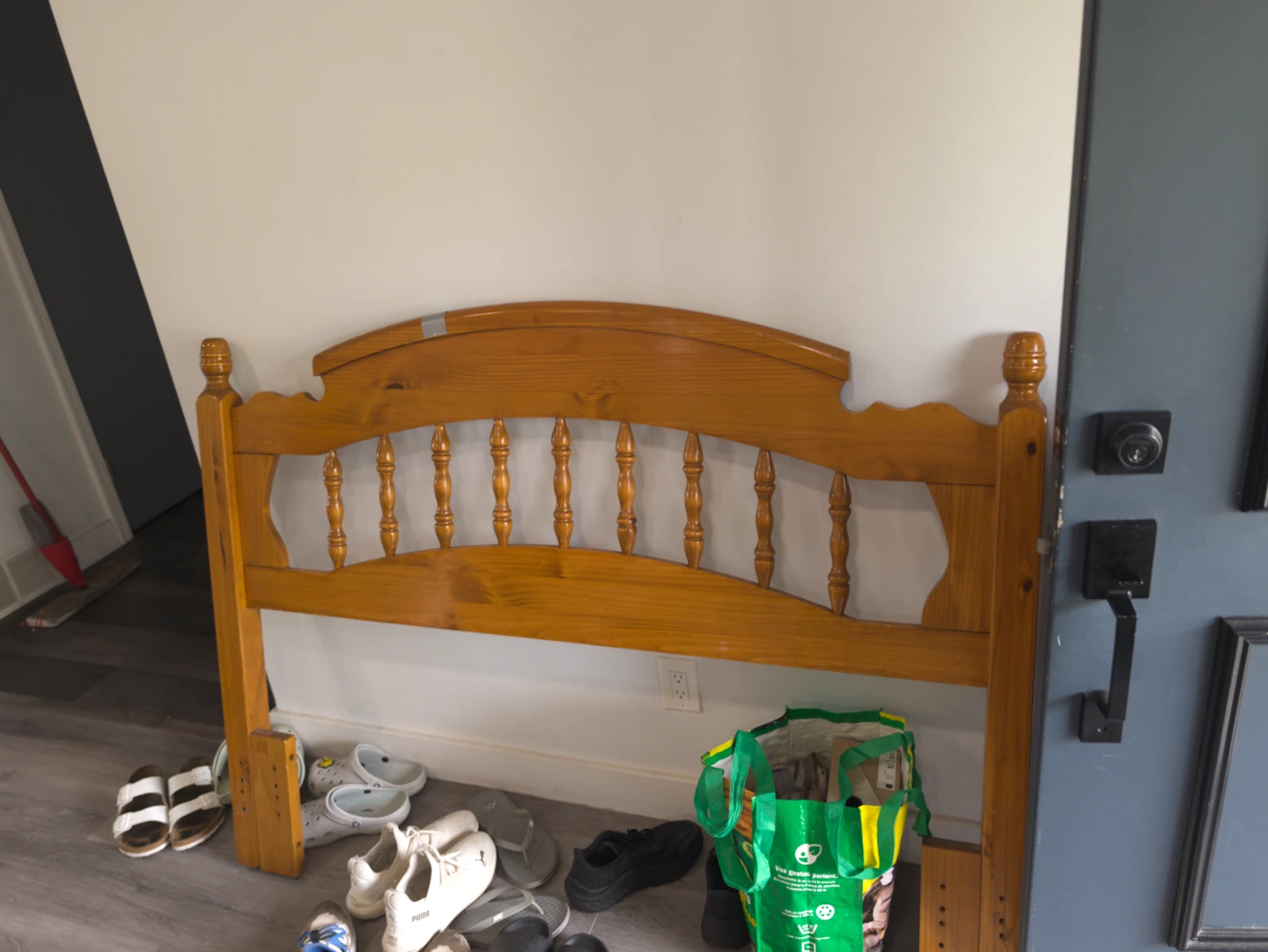 Wooden twin headboard with mattress and box spring