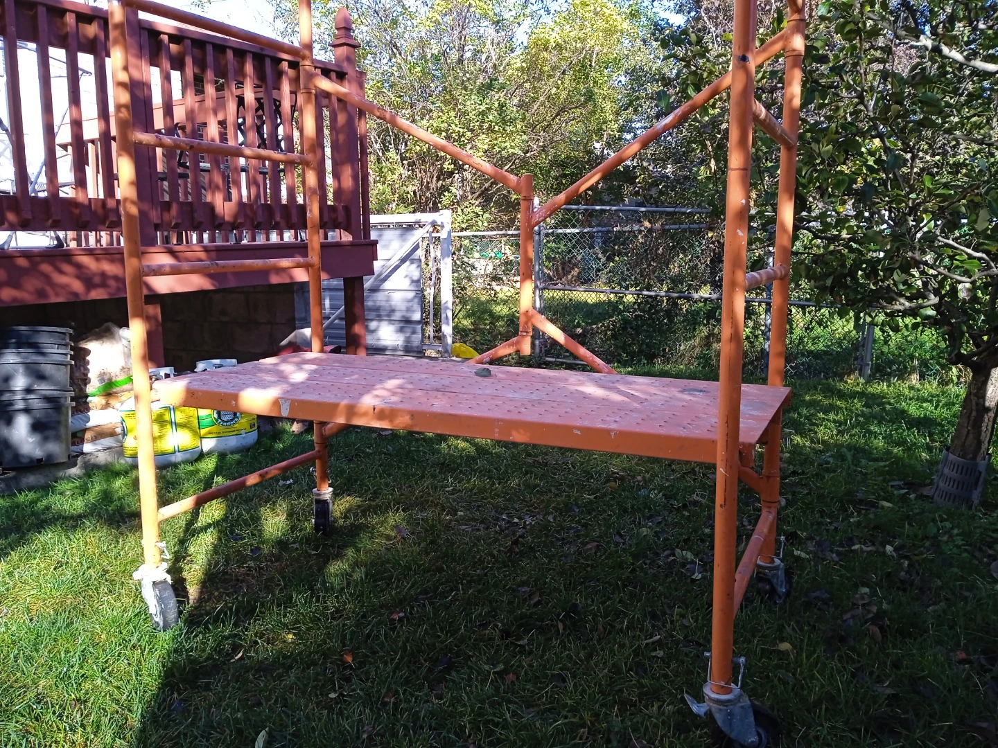Orange metal rolling scaffold - photo 2