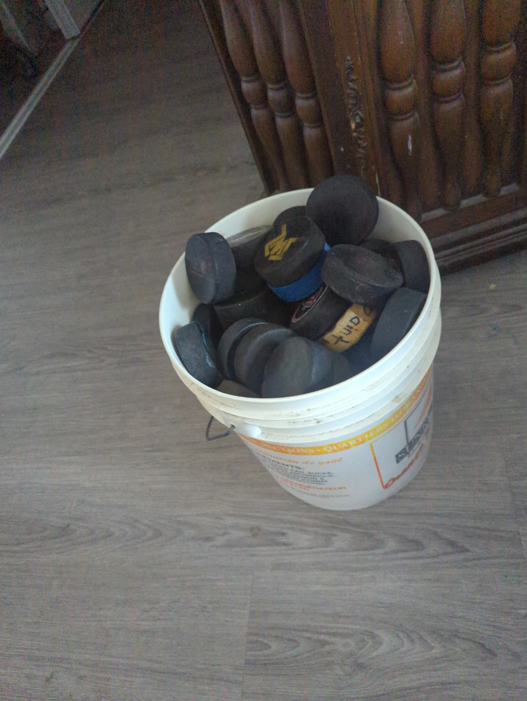 Pail of hockey pucks