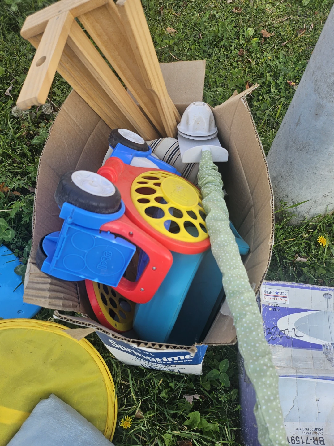 Box of mixed toys and household items