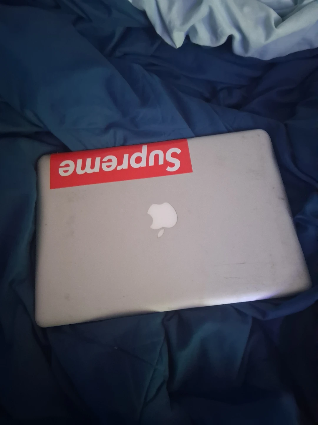 Apple MacBook with Supreme Sticker