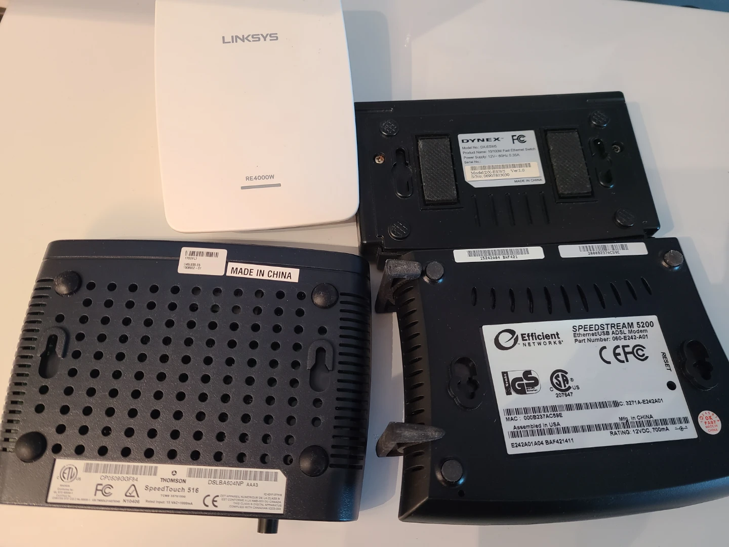 Collection of assorted networking routers and modems - photo 5