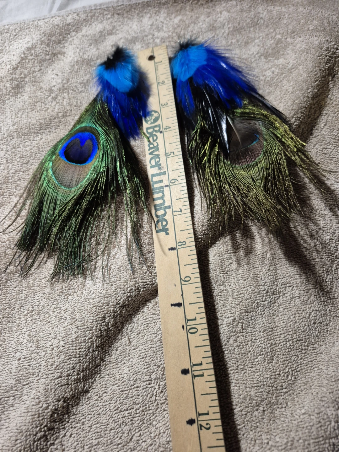 Peacock feather earrings with blue accents