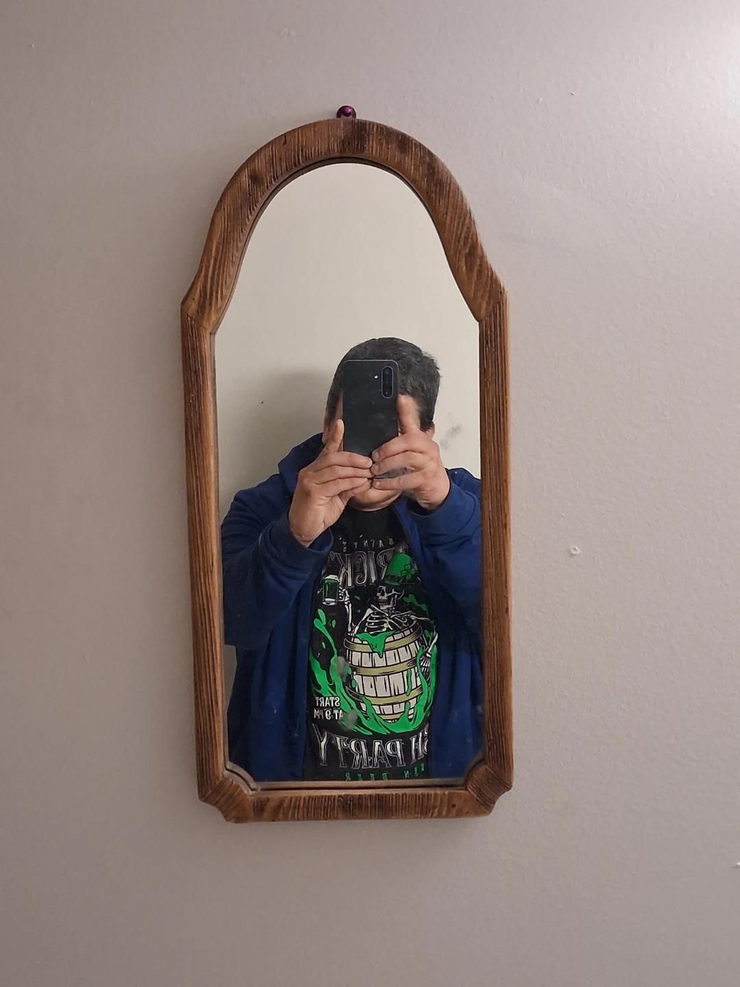Arched wooden wall mirror