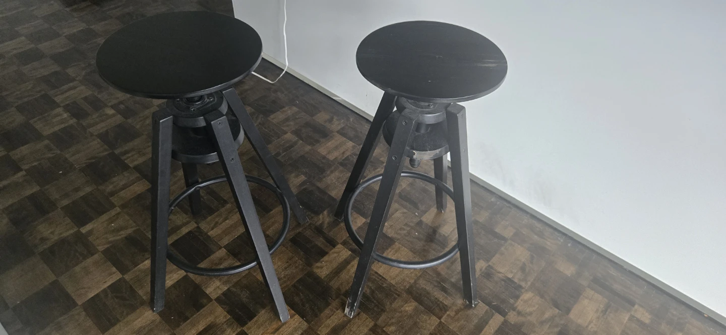 Two Black Adjustable Bar Stools