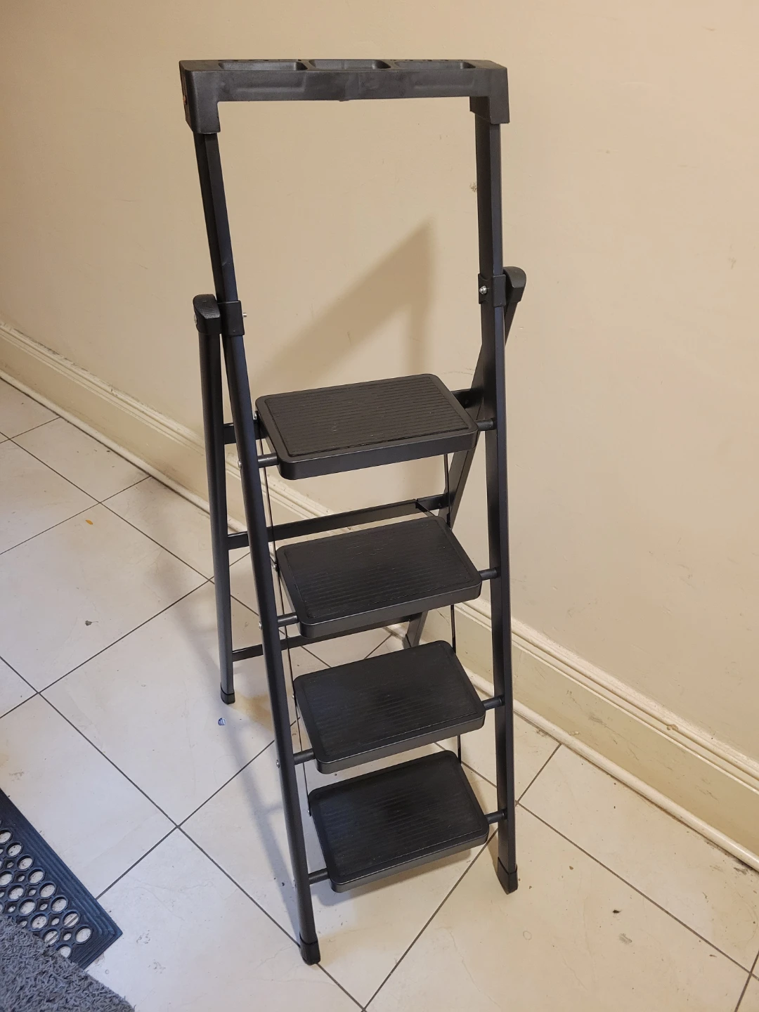 Brand new. 4-Step Folding Ladder with Tool Tray