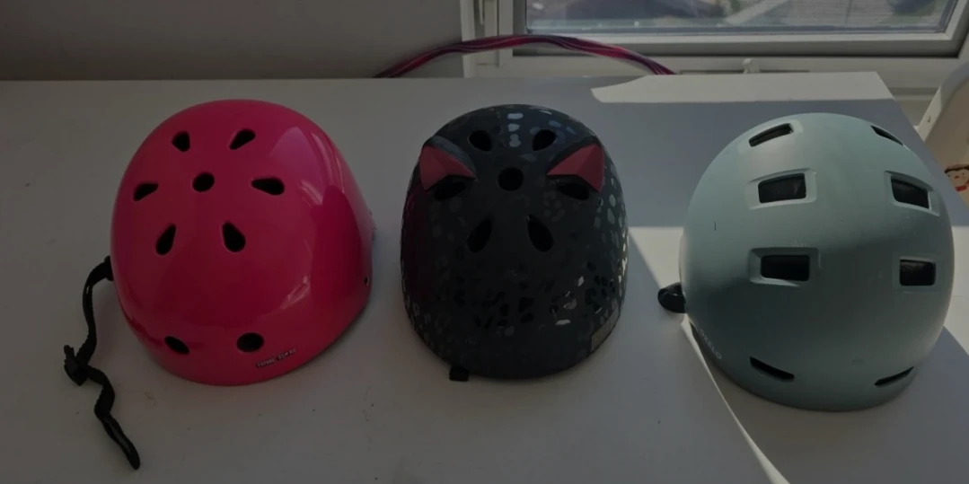 Set of three children's sports helmets