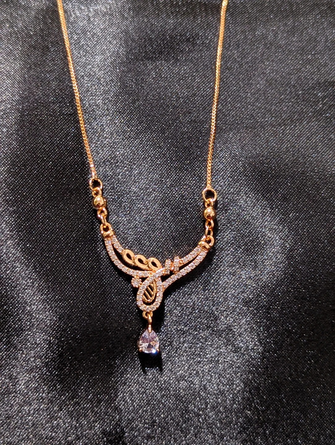 Gold-toned necklace with crystal pendant