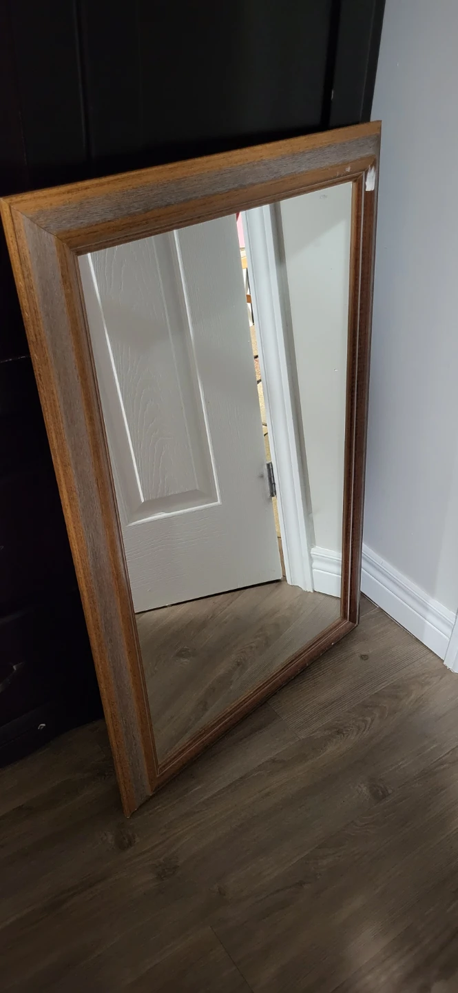 Wall mirror with wooden frame