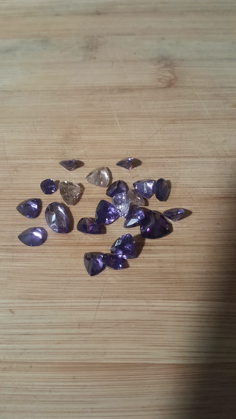Loose Purple and Clear Faceted Gemstones