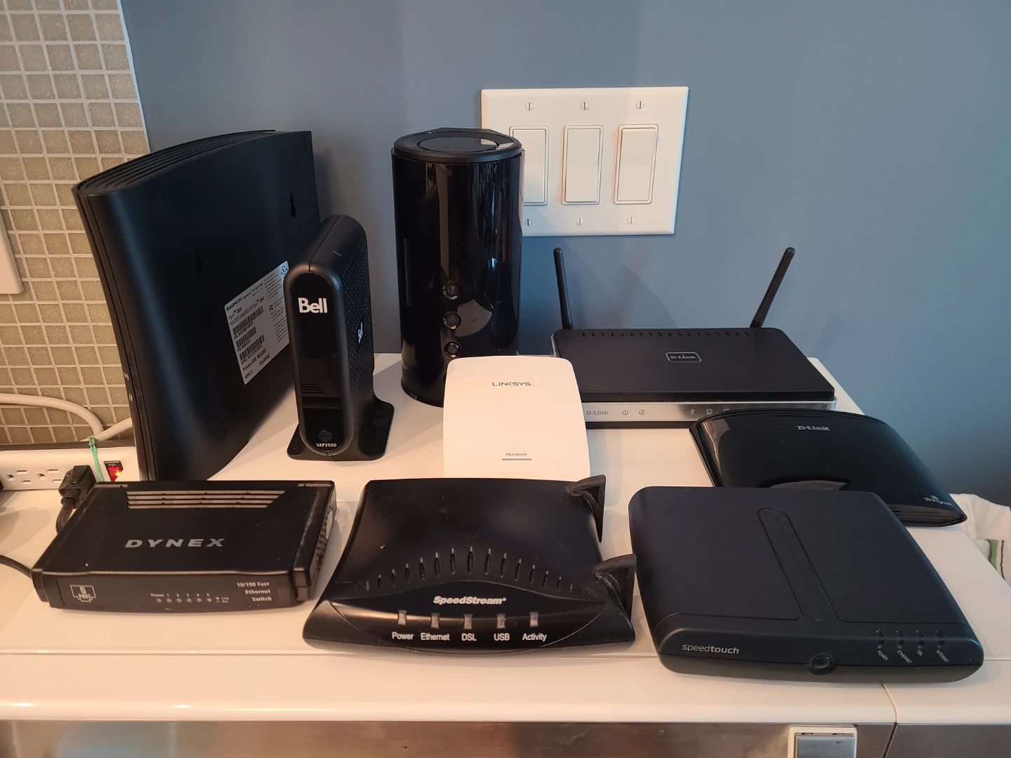 Collection of assorted networking routers and modems