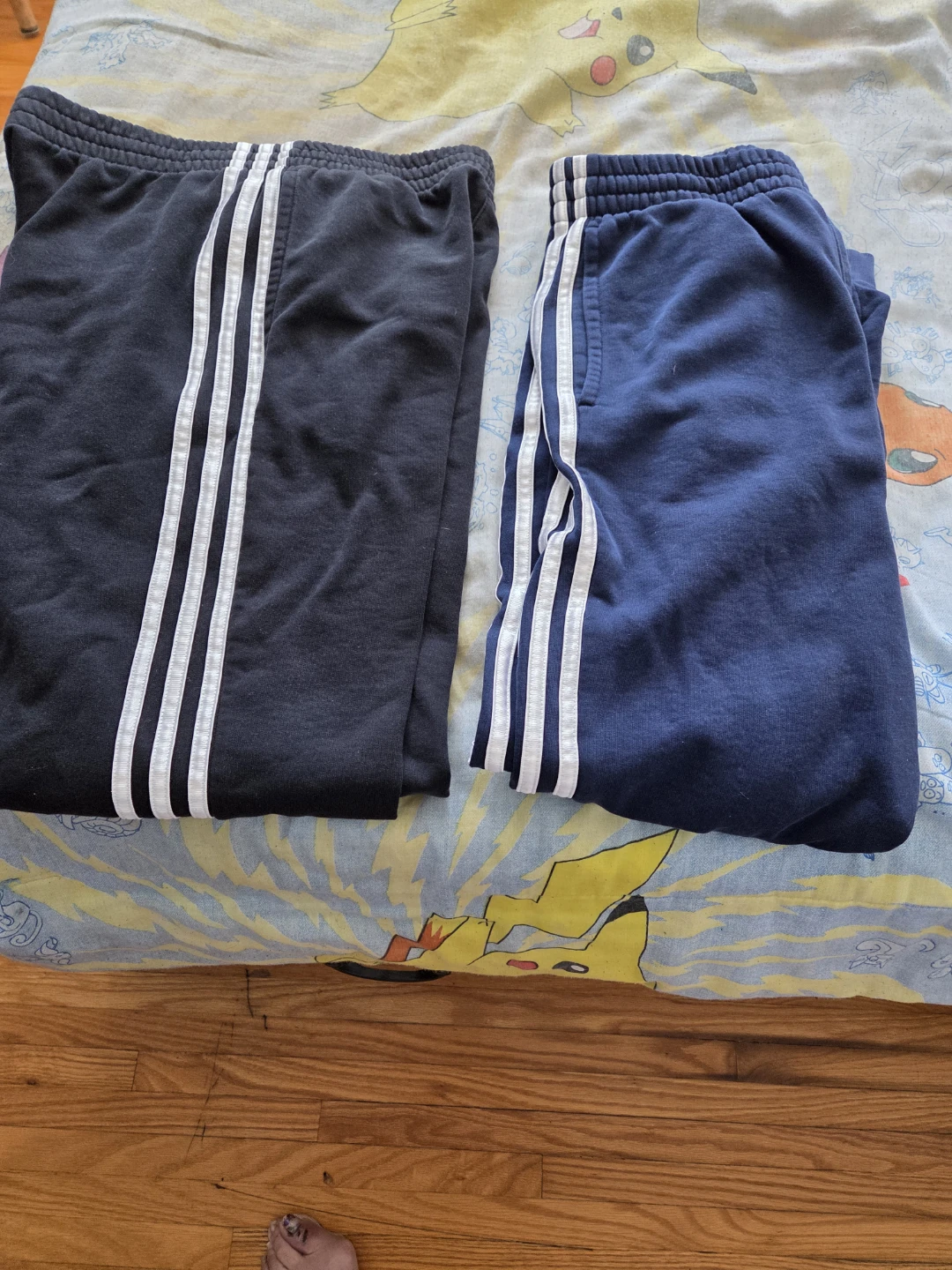 Two pairs of Adidas track pants