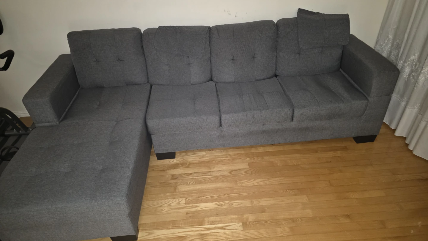 We sell gray fabric L-shaped 4-seater sofas (Mississauge).