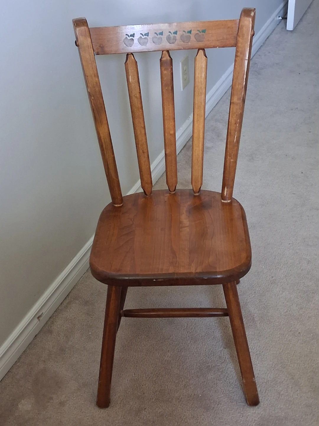 Solid wood chair with apple detail