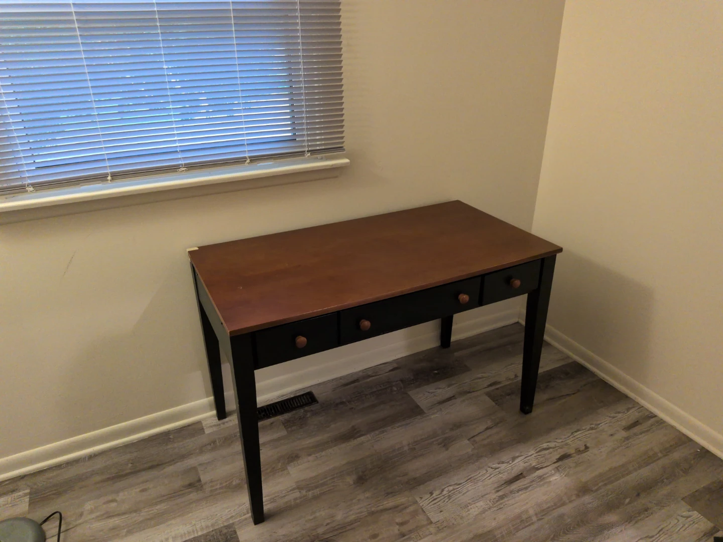 Wooden writing desk with three drawers