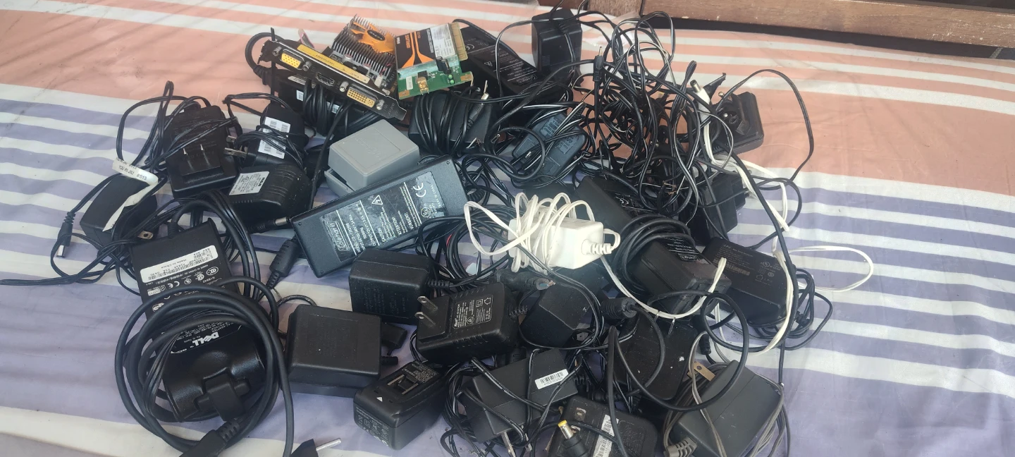 Assorted Power Adapters and Computer Parts