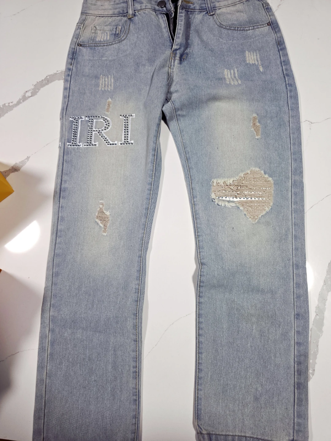 AMIRI Light Wash Distressed Jeans